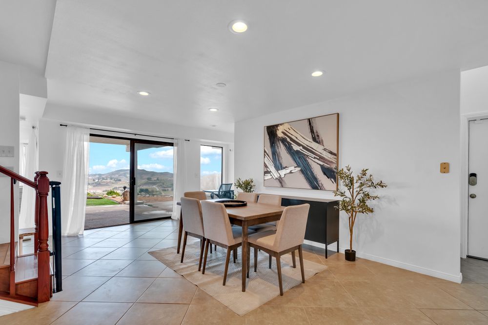 REAmplified Care Murrieta: bright dining and gathering space with hillside views through sliding glass doors, from the program’s public Yelp photo gallery.